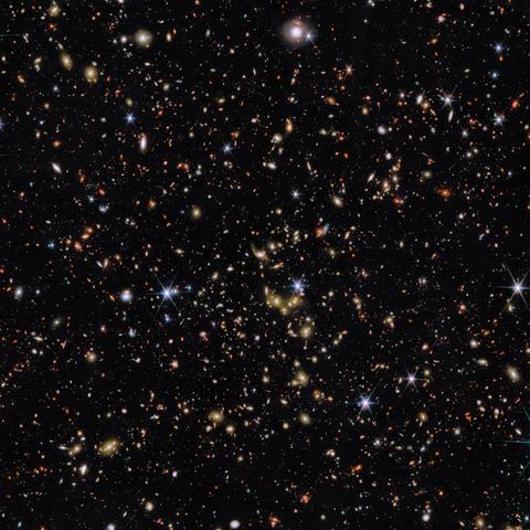 The objects in this frame span an incredible range of distances, from stars within our own Milky Way, marked by diffraction spikes, to galaxies billions of light-years away. The focus of this image is a group of galaxies, the largest concentration of which can be found just below the centre of this image. These galaxies glow with white-gold light. We see this galaxy group as it appeared when the Universe was 6.5 billion years old, a little less than half the Universe’s current age.

ESA/Webb, NASA & CSA, G. Gozaliasl, A. Koekemoer, M. Franco, and the COSMOS-Web team