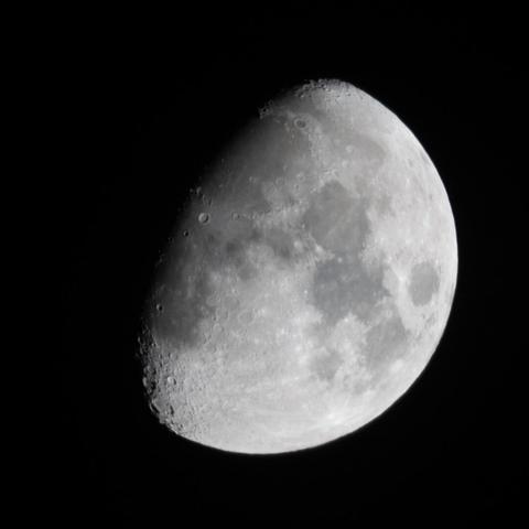 Closeup photograph of a waxing gibbous moon.