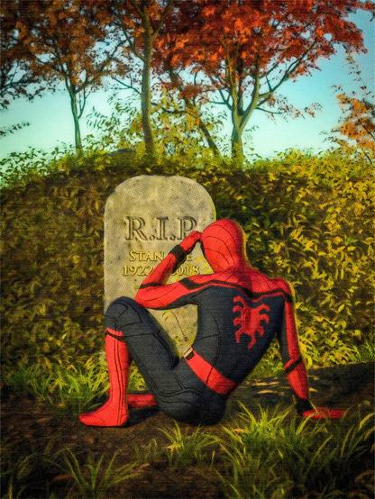 Spider-Man seen from behind sitting in front of a gravestone in the grass, a hedge in the background. On the gravestone the writing is partially obscured by Spider-Man, but you can surmise that on it is written "Stan Lee - 1922 - 2018"
