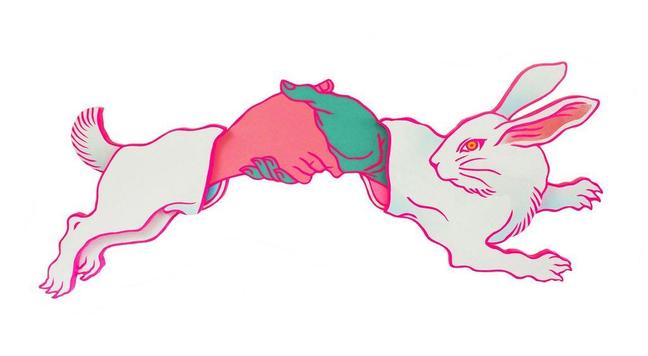 A painted wooden sculpture of a leaping rabbit with a vibrant pink and turquoise hand emerging from its body.
