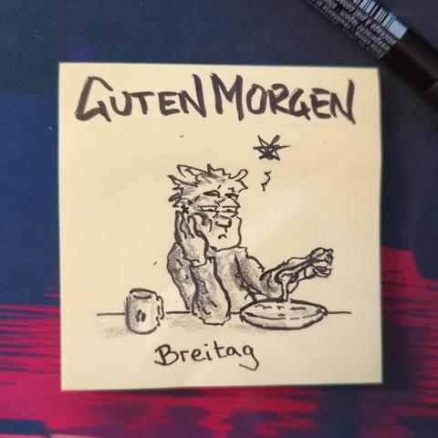 Auf einer gelben Haftnotiz steht "guten morgen" darunter ist ein müder Mann mit zerzausten Haaren zu sehen, der den Kopf in seine Hand stützt und mit der anderen lustlos den Brei vom Löffel zurück in die Schüssel tropfen lässt.
Es ist Breitag