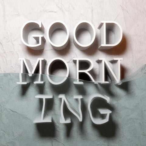 white marble background with water in front and 3D letters reading Good morning