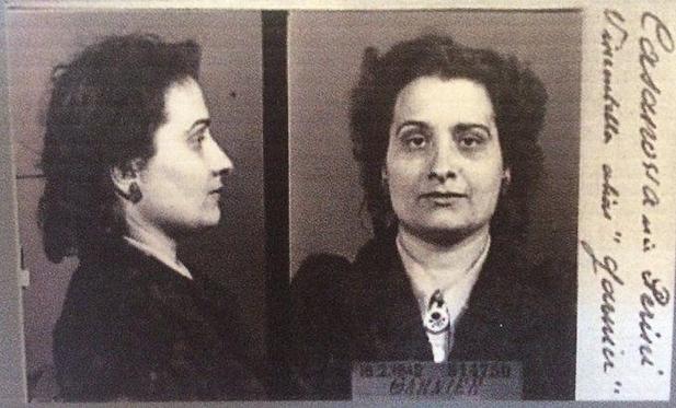 A mugshot photo of Danielle Casanova. She is photographed from the front and the profile. A woman with long, bit messy hair.