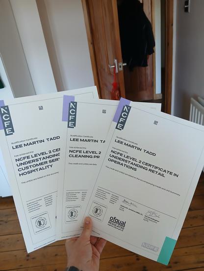 Three NCFE qualification certificates all with my name on.

One is in hospitality, one in cleaning, and one in retail