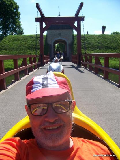 On the way back out, Theo behind me. You can see part of the fortress. The bridge can open so that attackers would have to go through the moat, and the big door shut so they'd have to fight uphill once they got out of the water. It would have been quite a difficult place to attack.