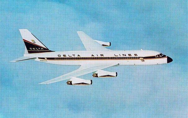 Plane is seen above the clouds. It is flying left to right.