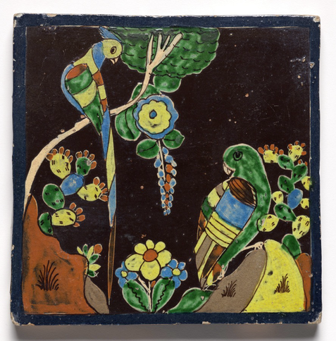 square glazed ceramic tile, decoration of two stylized parrots perched in floral landscape, bright red, yellow, green, blue, and brown colors on black background, with thin dark blue border frame