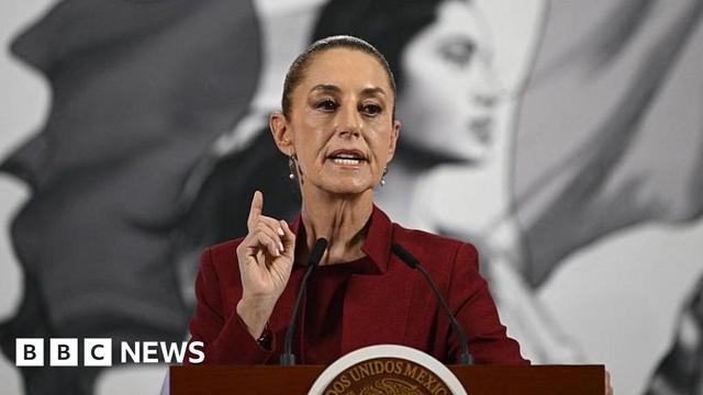 An image of President of Mexico Claudia Sheinbaum in a red suit.