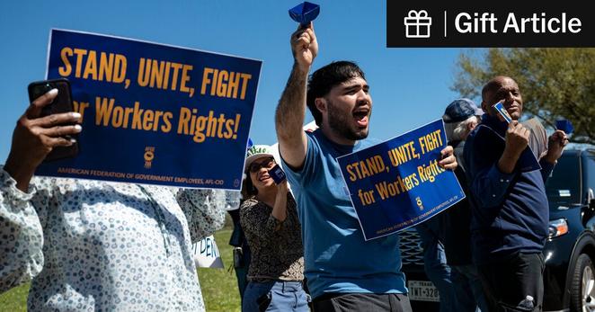 Protesters outside the NASA Johnson Space Center in Houston rallied in March to protect the jobs of embattled federal workers.