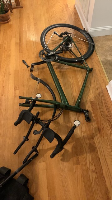 Semi-disassembled bicycle lying on the floor