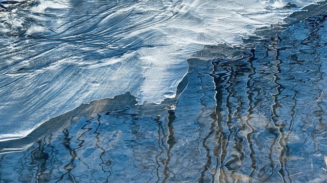 Thin ice on a flowing stream.