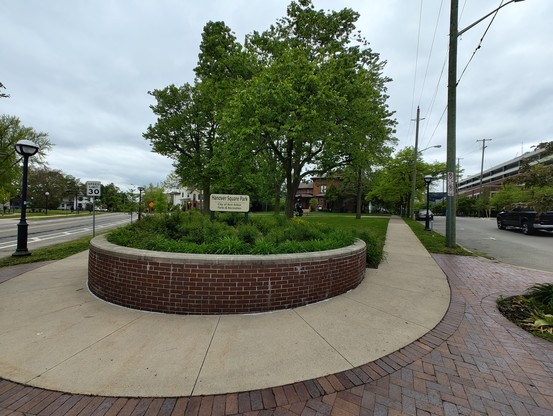 A wide angle photo of Hanover Square park on the intersection of Packard St & S Division St in Ann Arbor, MI.