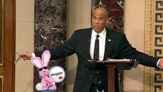 a surprised-looking Senator Corey Booker as the Energizer Bunny marches across C-Span