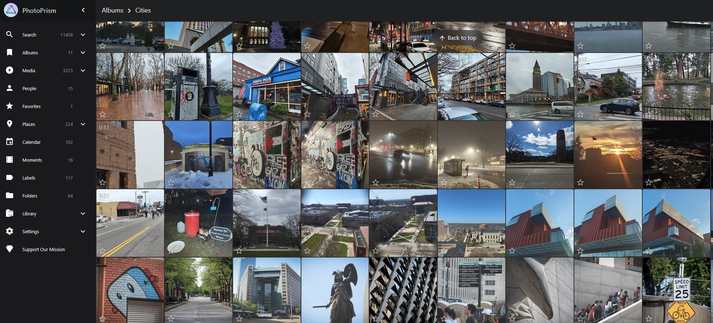 Screenshot of the photo prism UI, navigated to my "Cities" album with a wall of images all related to urban life... buildings, bicycles, statues, murals, trees, skylines...