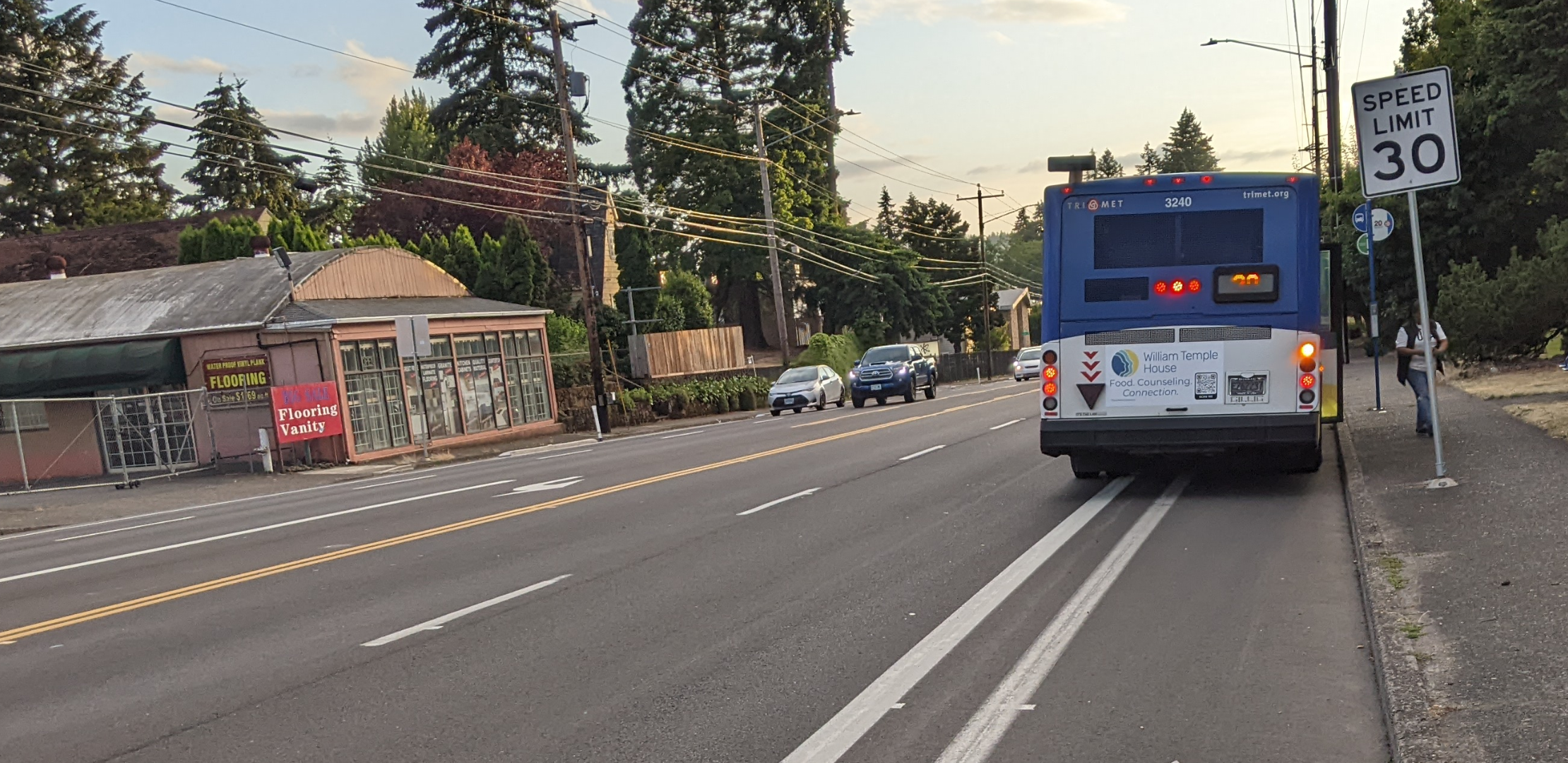 Same scene, but a bus stopped on the bike lane.