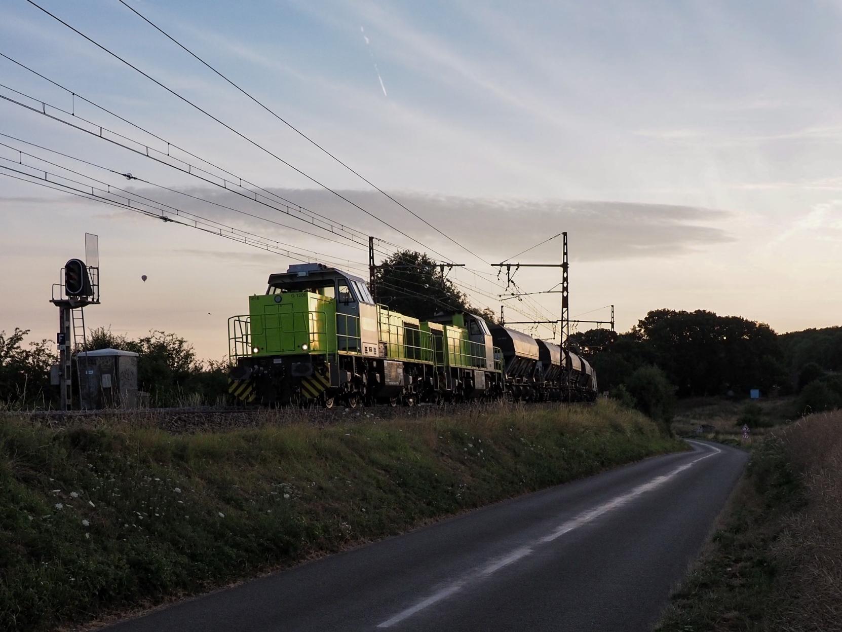 Two Diesel locos hauling a service train from a track work site, which was set up during the night