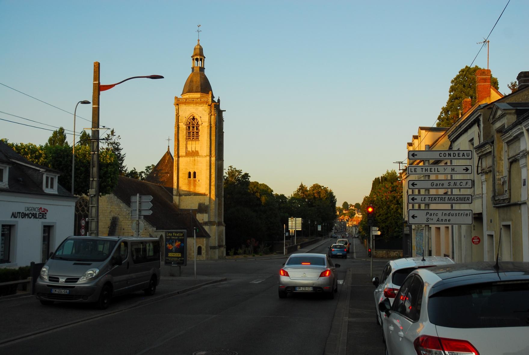 The tower of a church still illuminated by the last sun rays of the day