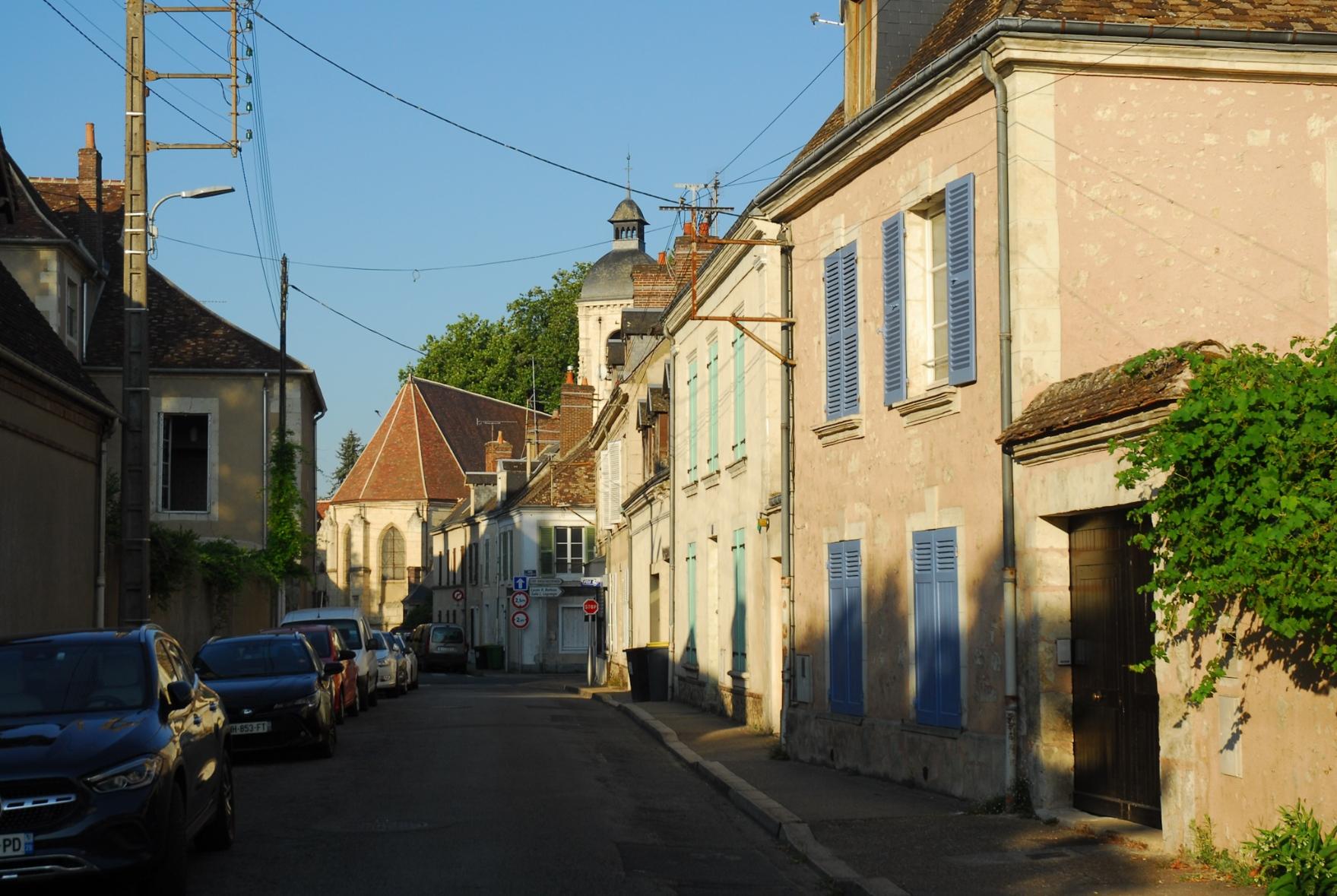 Old buildings and a half hidden church in the background