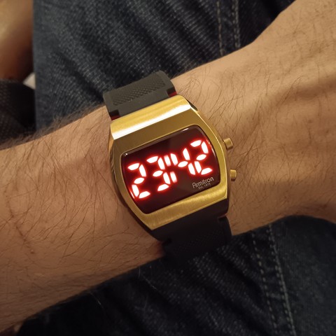 Armitron Griffy watch with LEDs lit and showing 23:42