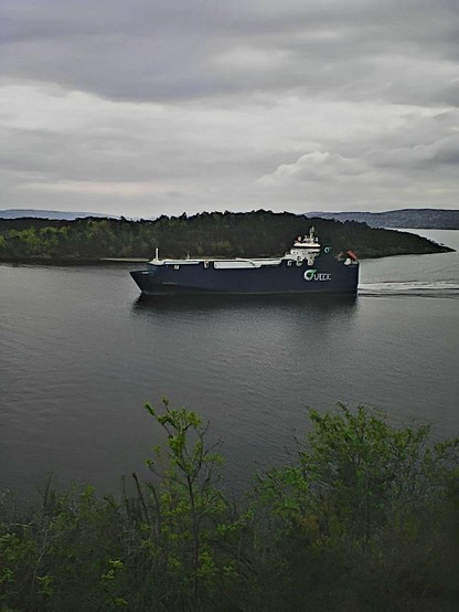 A cargo ship passing between the islands in the Oslo fjord.