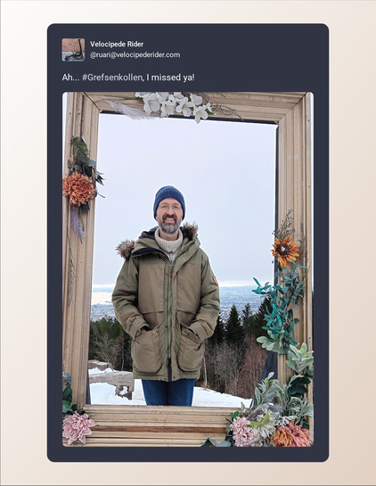 A screenshot of post by Velocipede Rider (@ruari@velocipederider.com) beautified by Mastopoet tool. It was posted on Dec 17, 2023

Ah... #Grefsenkollen, I missed ya!

Post has one attachment. The attachments alt text is:
Man standing looking at the camera with Oslo down in the distance. In the foreground are some pine trees. The entire picture is framed with a wooden frame. There are flowers around the frame.