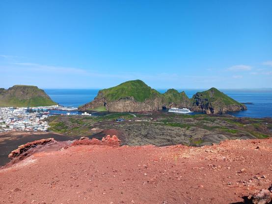 View from on the top of Eldfell volcanic cone on Vestmannaeyjar looking down at Heimaey