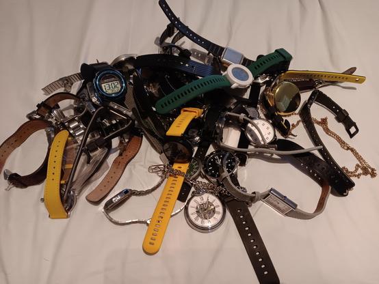A massive pile of wrist watches. 