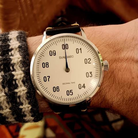 Decimal watch showing midnight. 