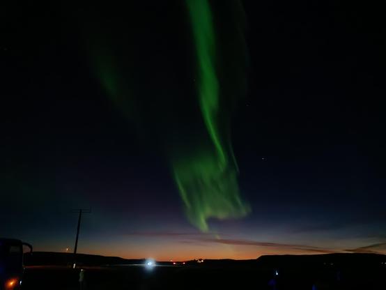 Lots of green in the night sky at late sunset. 