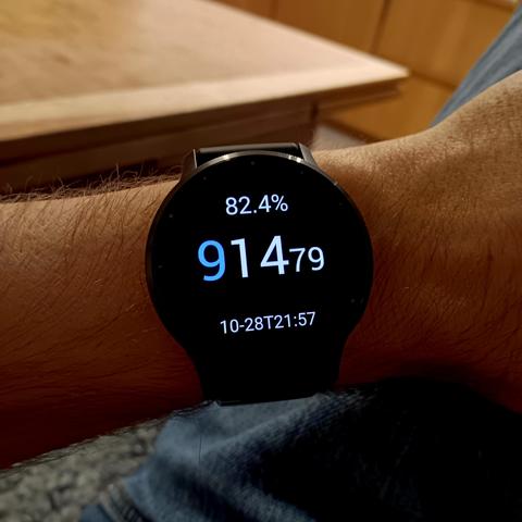 Garmin Venu 3, showing the time in decimal format. In addition, at the top it has the percentage through the year. At the bottom a time and date stamp in more traditional format. 