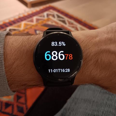 A Garmin watch showing the time in Decimal Time. The colours of the digits are in the French flag colours. 