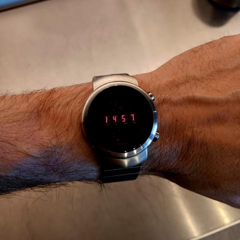 Steel, LED watch with very fine, small digits. 