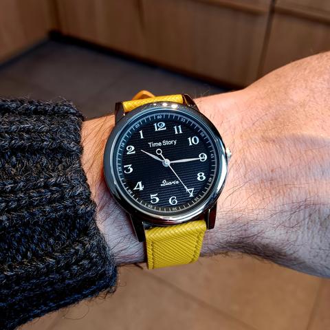 A watch displaying the time with w widdershins dial. 