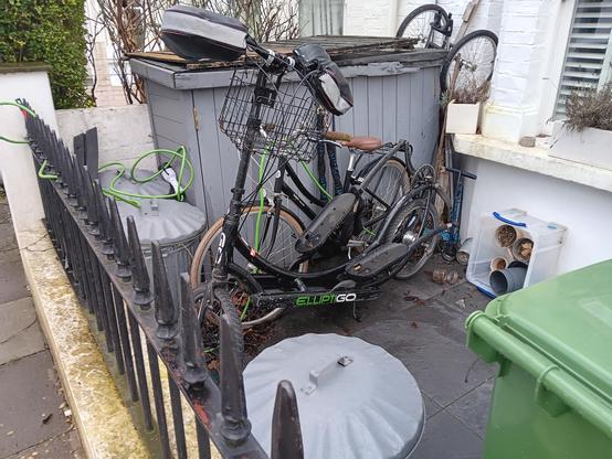 ElliptiGO and another bike bhind railings