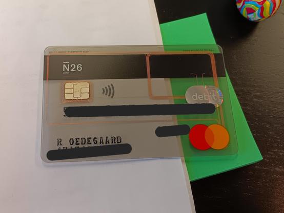 A transparent MasterCard. The account details of which have been blacked out. 

Through the clear plastic it is possible to see the thin copper wires that form the NFC aerial. 