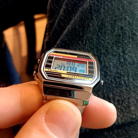 Skmei digital watch tilted backwards. The numbers remain highly readable, albeit with a little shadowing underneath. 