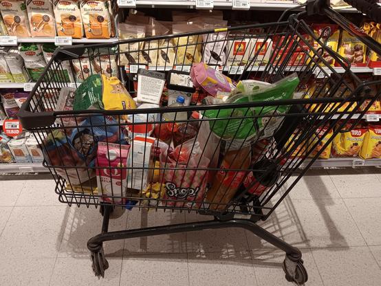 A shopping trolley full of groceries. 