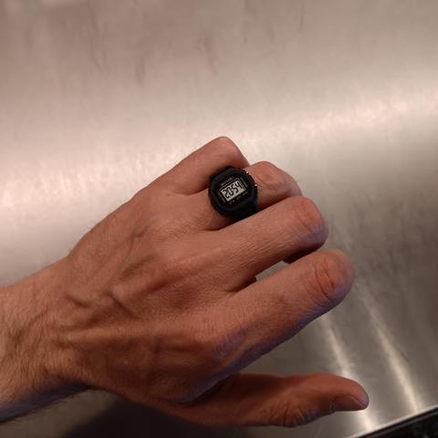 Hand with a digital ring watch