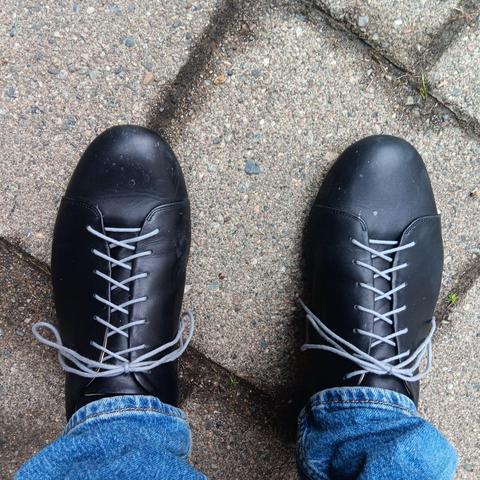 Black shoes with very long, grap shoelaces