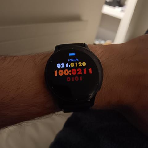 Watch with a ternary display. The battery percentage reads 10000%