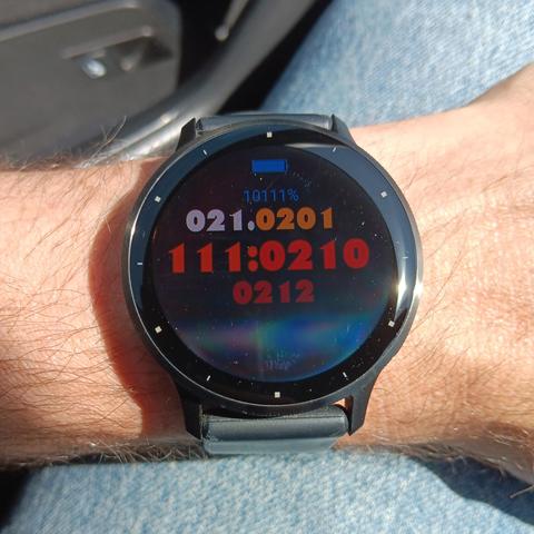 Watch with the following information encoded in ternary:

94% battery
7th Month, 19th day
13:21:23 (1:21:23PM)