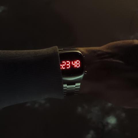 LED wrist watch at night.