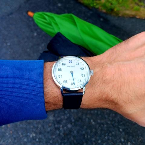 Single handed decimal watch, showing the time as 4.80.