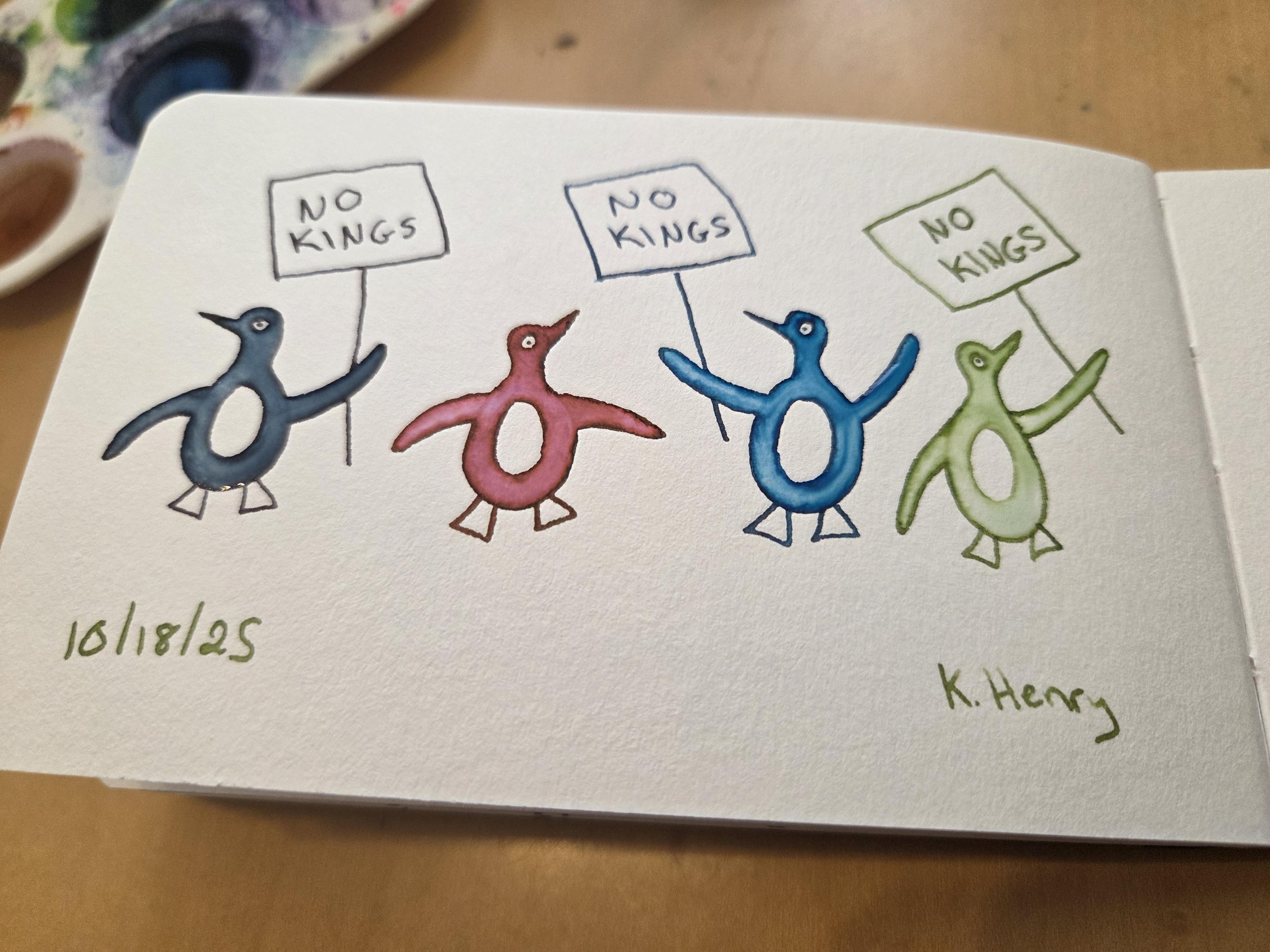 Hand drawn generative/procedural art in ink on an open page of my sketchbook. The abstract pattern looks like penguins of different colors marching together and holding signs that read "NO KINGS".