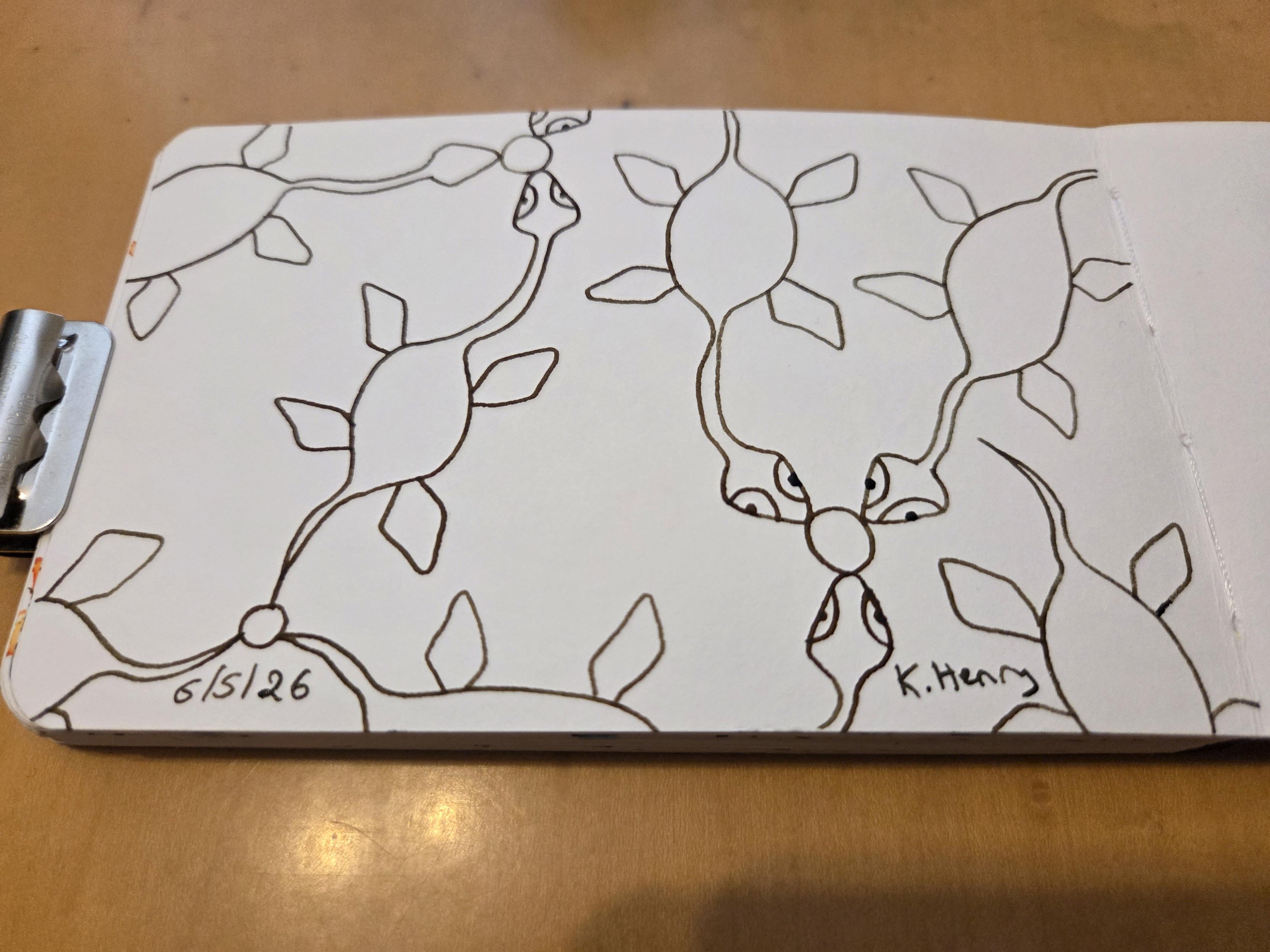 Hand drawn generative/procedural art in ink on an open page of my sketchbook. The abstract pattern looks like Mary Anning's  Plesiosaurs linked up in a network or floating.