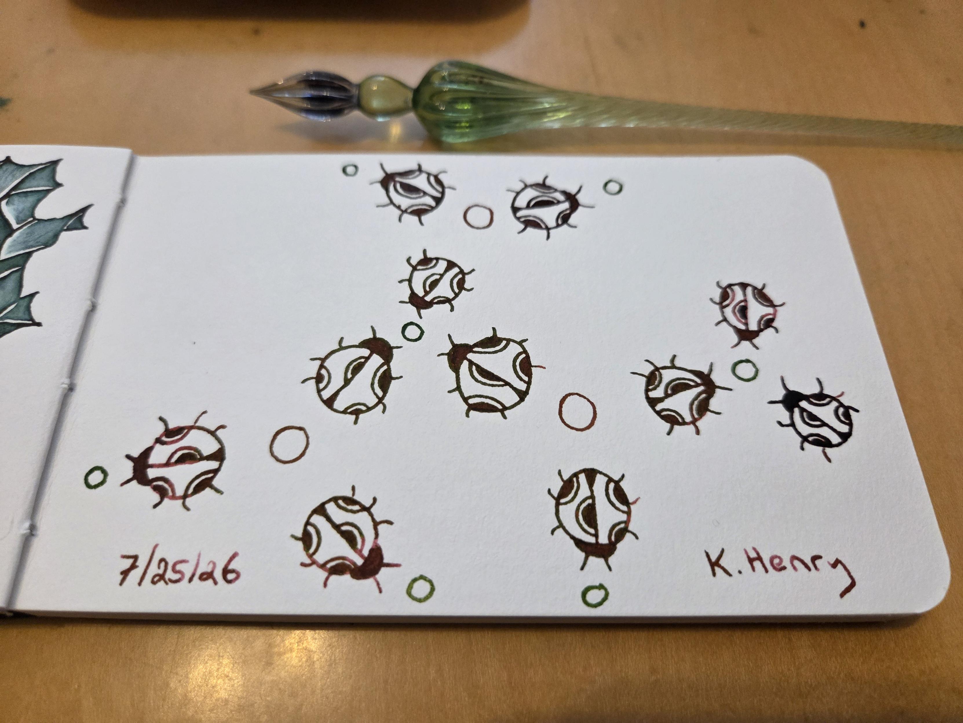 Hand drawn generative/procedural art in ink on an open page of my sketchbook. The abstract pattern looks a bit like a bunch of ladybugs arranged in a network diagram.