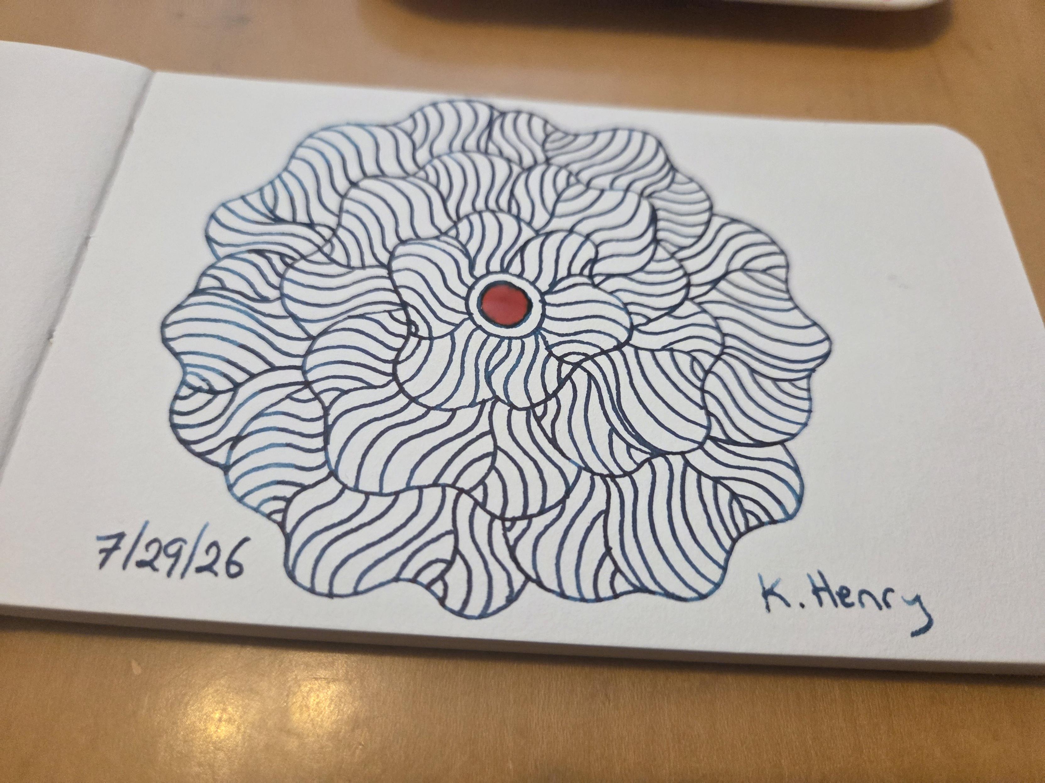 Hand drawn generative/procedural art in ink on an open page of my sketchbook. The abstract pattern is floral.