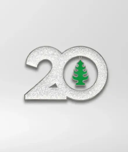 A glittery 20 with a pine tree air freshener in the zero