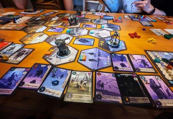 Expeditions board game with a pair characters from the expansion and lots of purple cards.