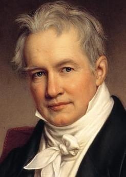 Portrait d’Alexander von Humboldt, célèbre explorateur et géographe du début du 19ème siècle. Il est vêtu d’une tenue formelle de l’époque, avec une chemise blanche et un manteau sombre. L’arrière-plan est neutre, mettant en valeur sa posture et son habillement.